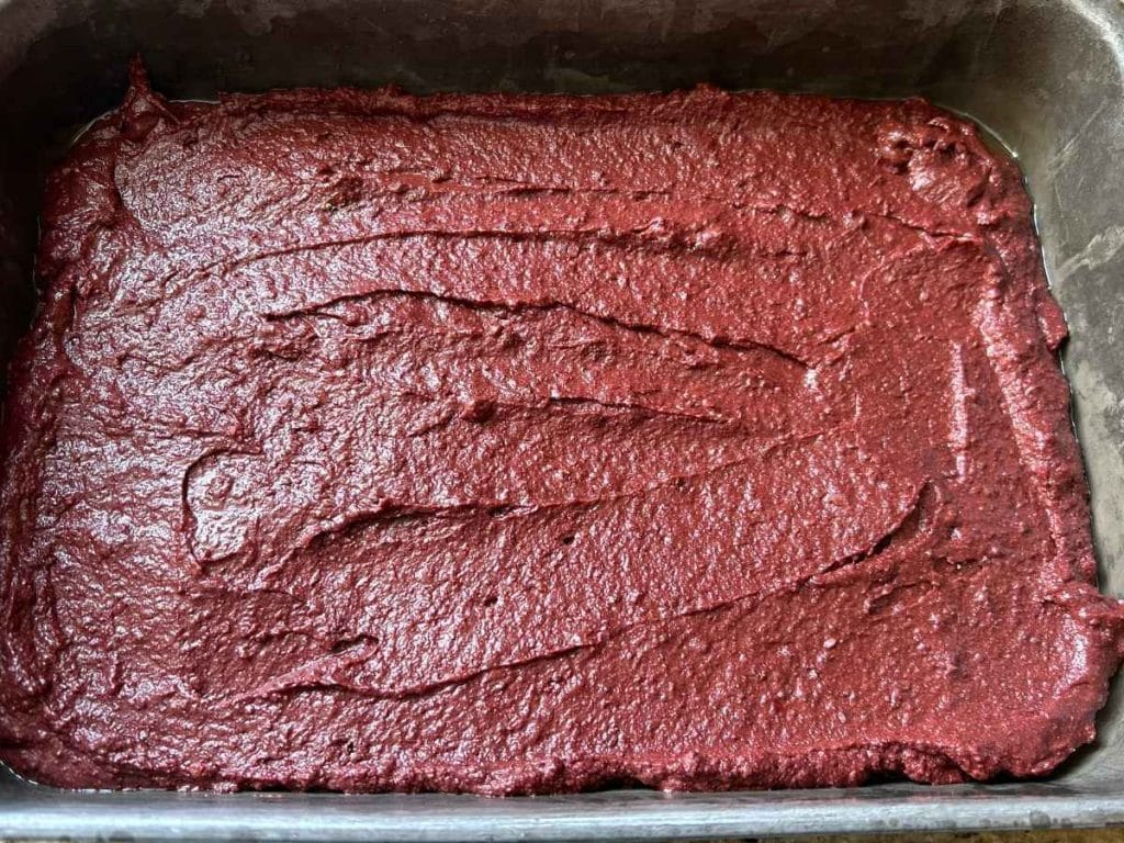beet brownie batter in a baking pan