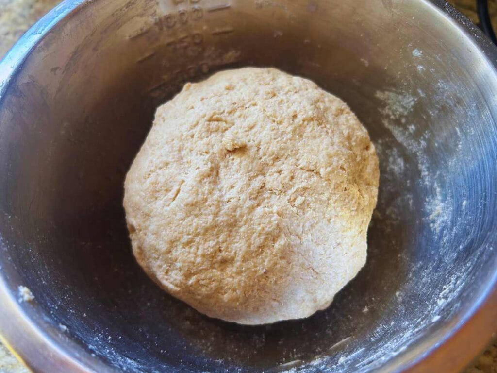 ball of biga in a mixing bowl