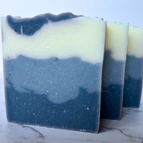 three bars of three layer blue eucalyptus mint tallow soap arranged in a row