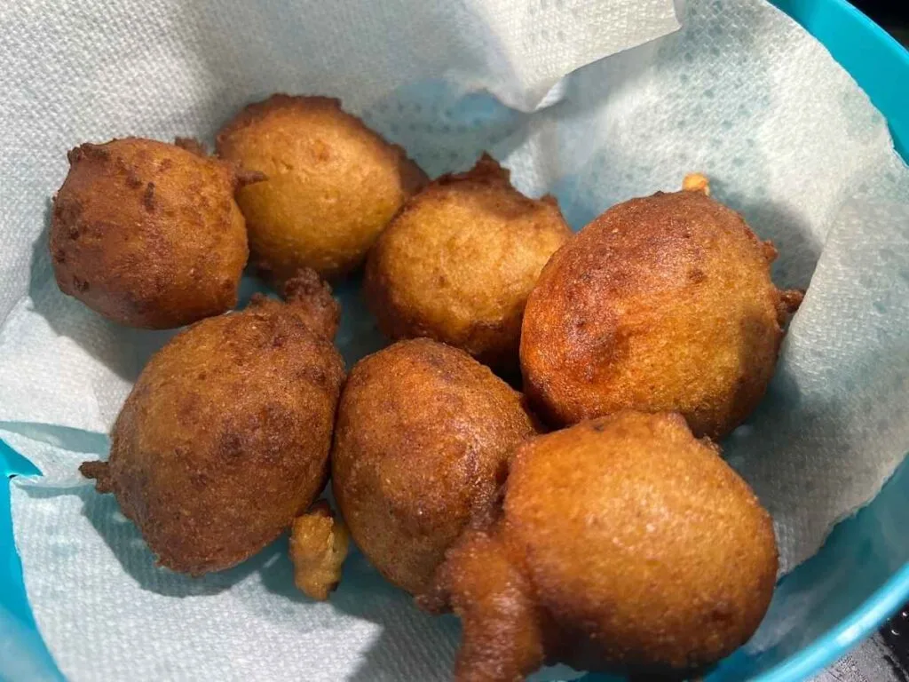 Zeppole Italian Ricotta Donut balls straining in a paper towel