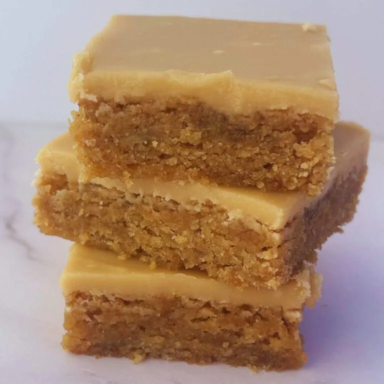 three browned butter banana blondies stacked up