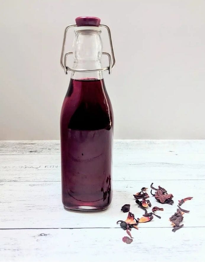 swing top bottle of hibiscus simple syrup