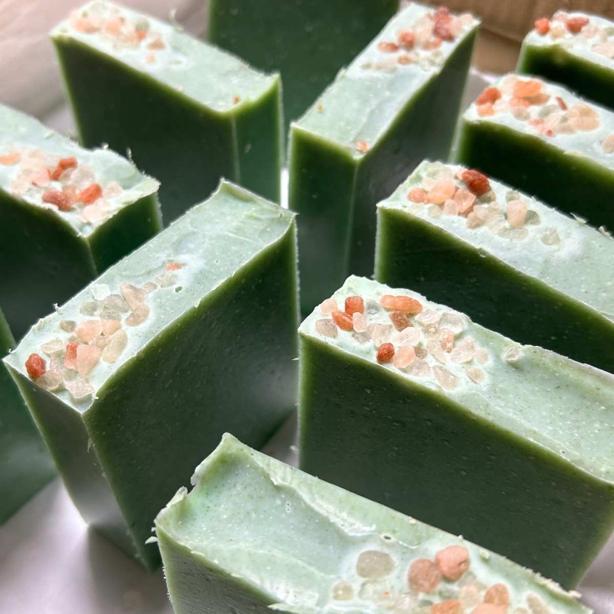 bars of rosemary and mint tallow soap topped with Himalayan salt