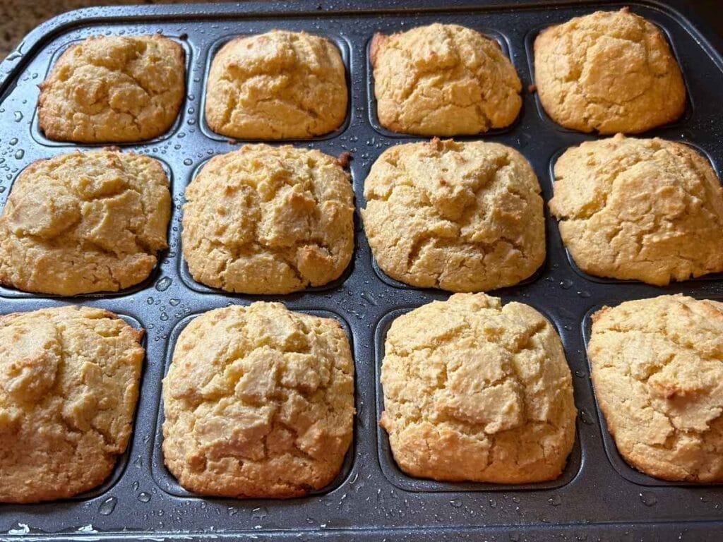 baked cornbread muffins in the pan