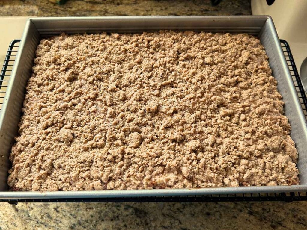 apple pie coffee cake cooling on a wire rack