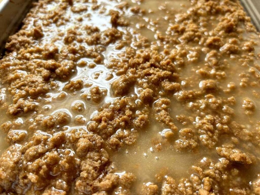 close up of glaze on a crumble topping