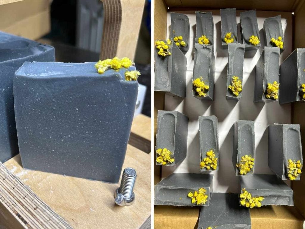 Shots of freshly cut bars of charcoal and tea tree tallow soap