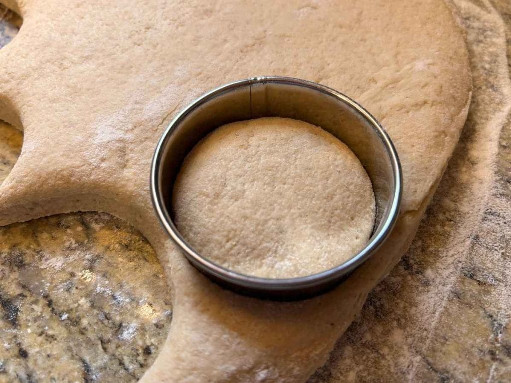circle cutter cutting dough for baking