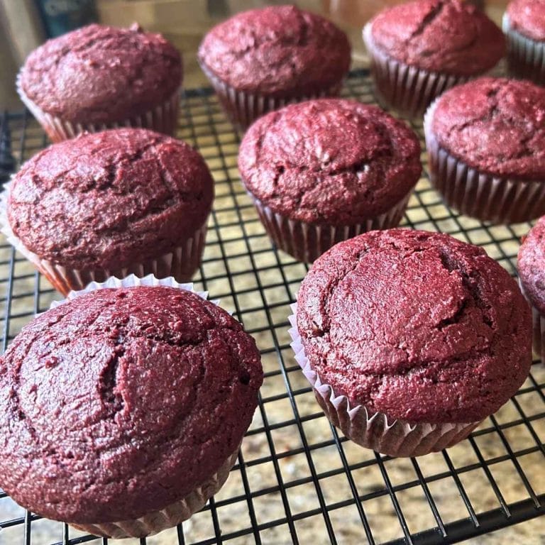 baked chocolate beet muffins on a cooling rack