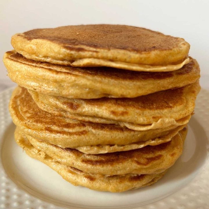 close up view of a stack of fluffy pancakes