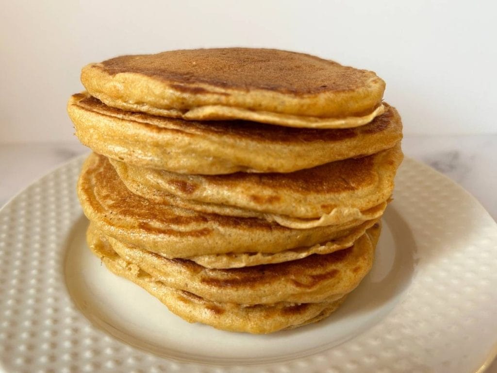 close up view of a stack of fluffy pancakes