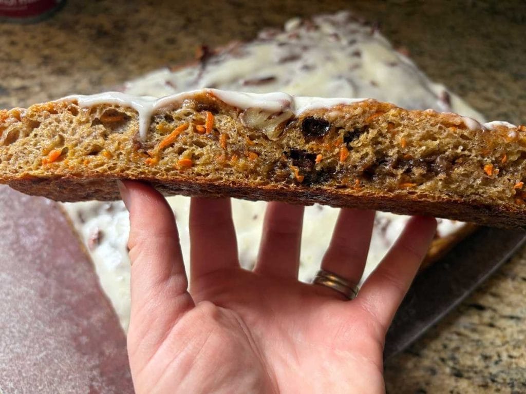 side view of a slice of sourdough carrot cake focaccia