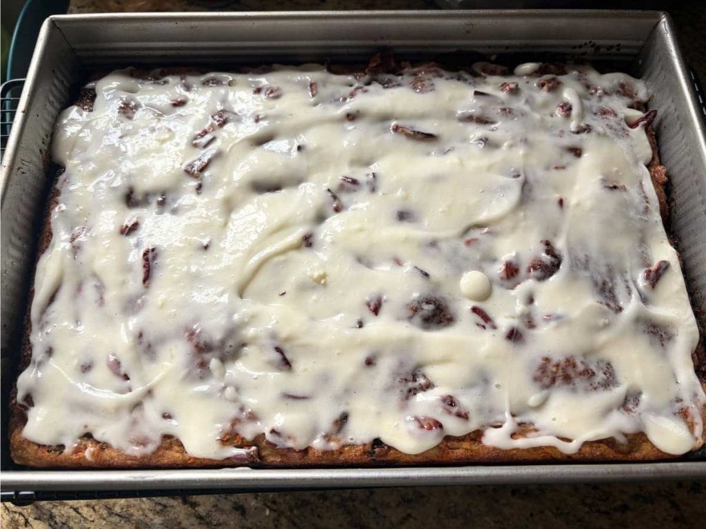 pan of iced sourdough carrot cake focaccia