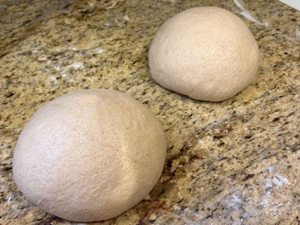 shaped sourdough dough balls on a countertop