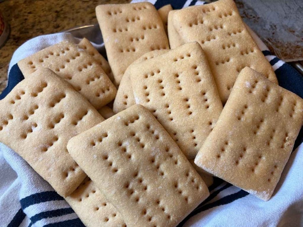 sandwich thins made with fresh milled flour in a towel line basket