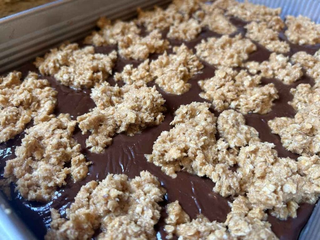 oatmeal fudge bars in a pan before baking