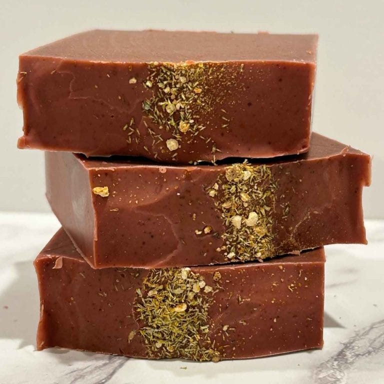 three bars of red citrus sorbet tallow soap stacked up