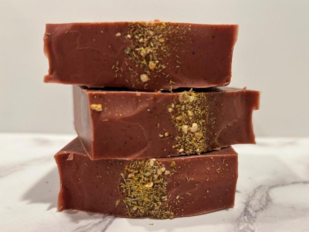three bars of red citrus sorbet tallow soap stacked up
