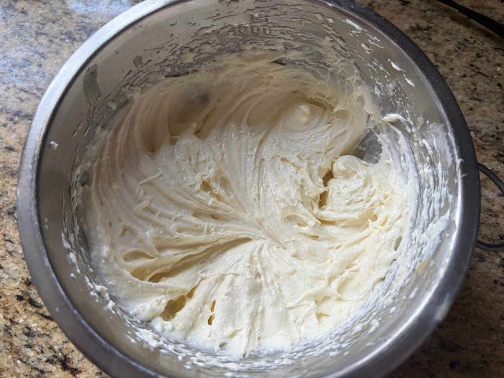 whipped cream cheese in a mixing bowl
