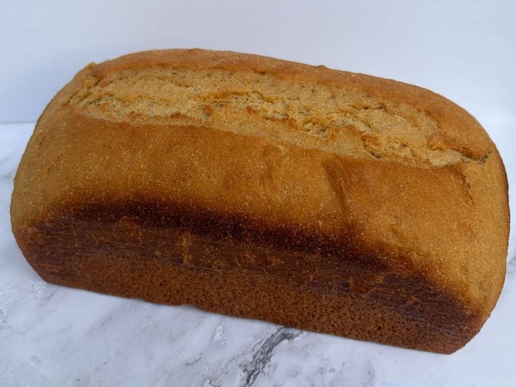 honey wheat bread loaf made with fresh milled flour